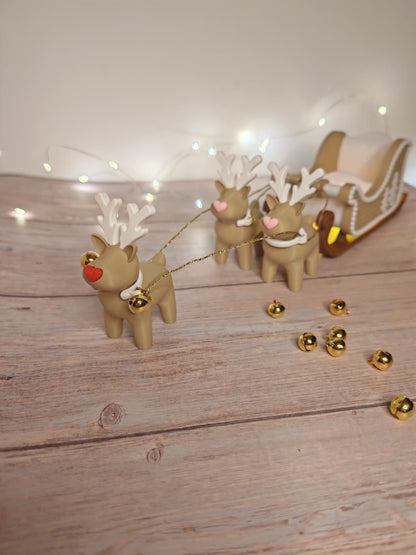 Weihnachtsschlitten mit 3 Rentieren – Rudolf mit roter Nase