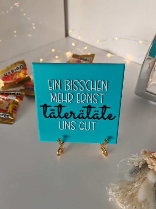 Sprüchekachel „Kachel 2 Go“ – "Ein bisschen mehr Ernst täterätäte uns gut"