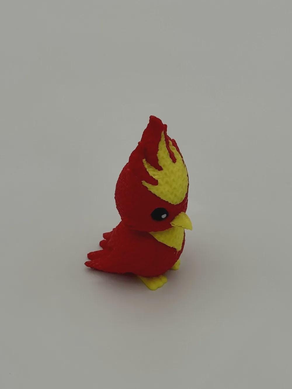 Niedlicher Phönix in Strickoptik  mythische Miniaturfigur