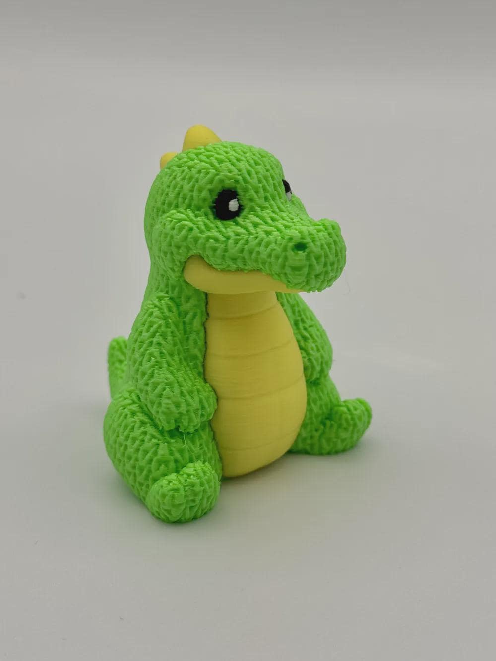 Kleiner Dino in Strickoptik  süße Miniaturfigur als Deko, Geschenk oder für Dino-Fans