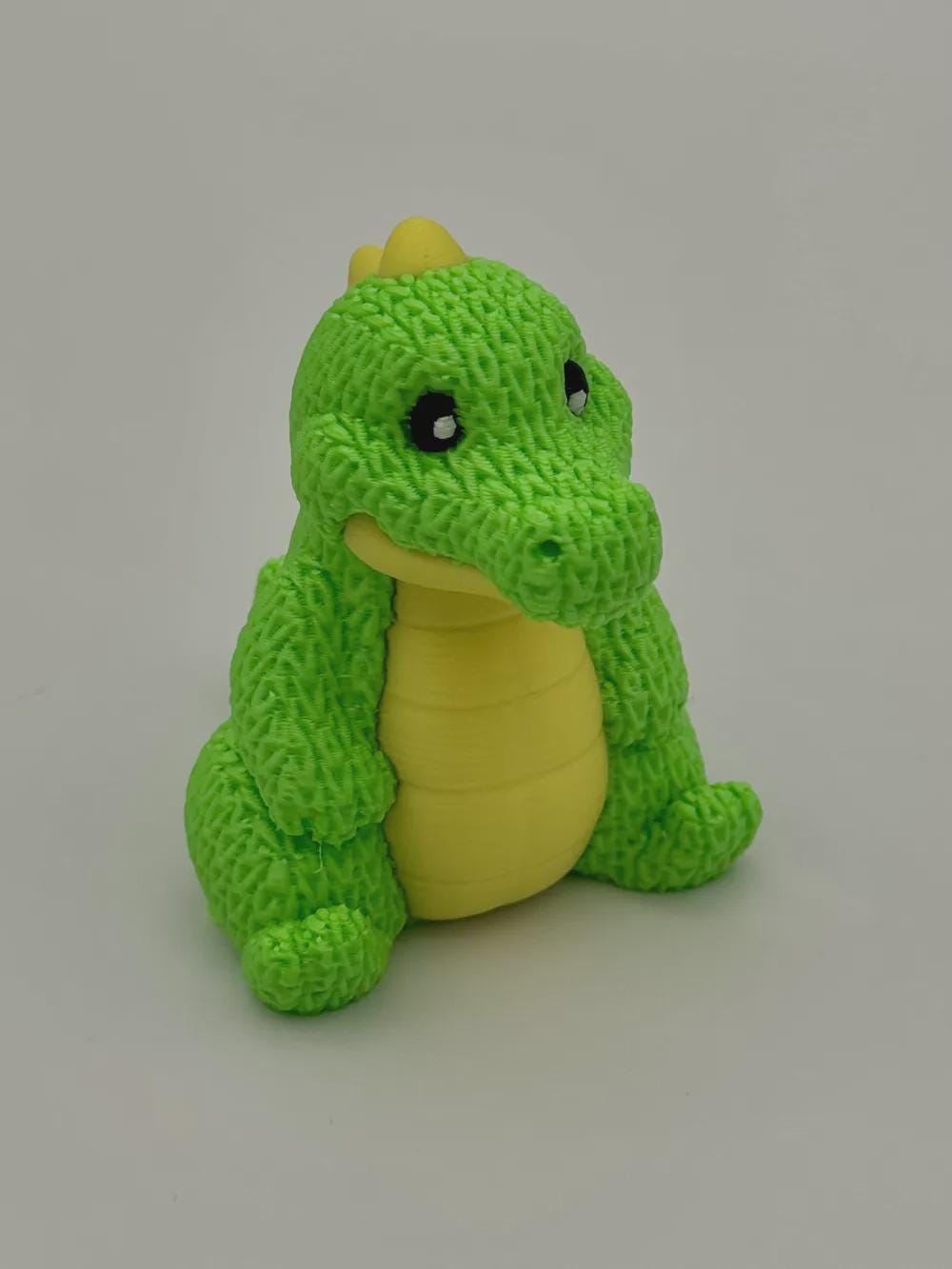 Kleiner Dino in Strickoptik  süße Miniaturfigur als Deko, Geschenk oder für Dino-Fans