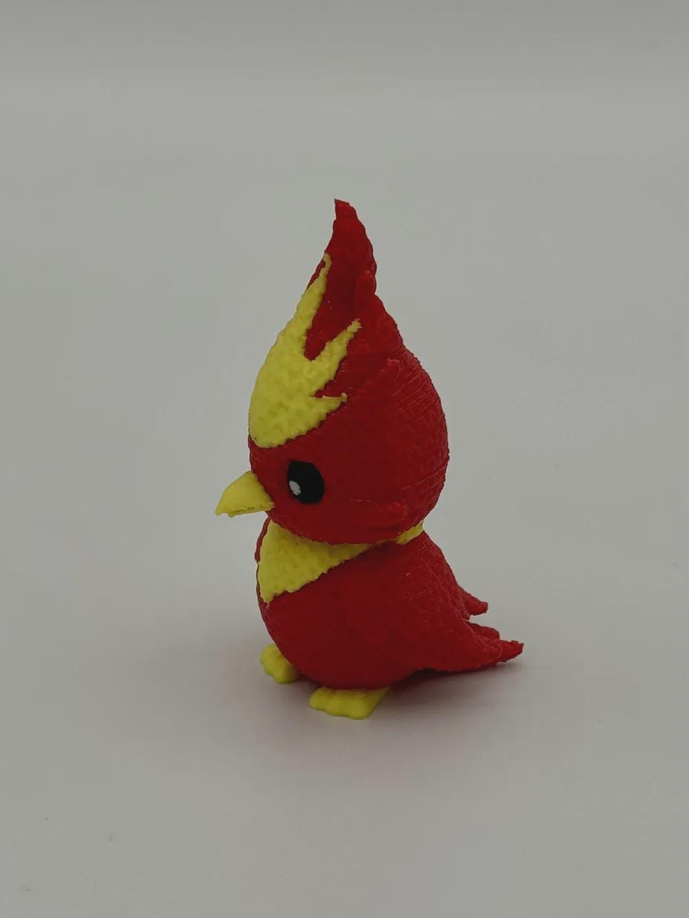 Niedlicher Phönix in Strickoptik  mythische Miniaturfigur